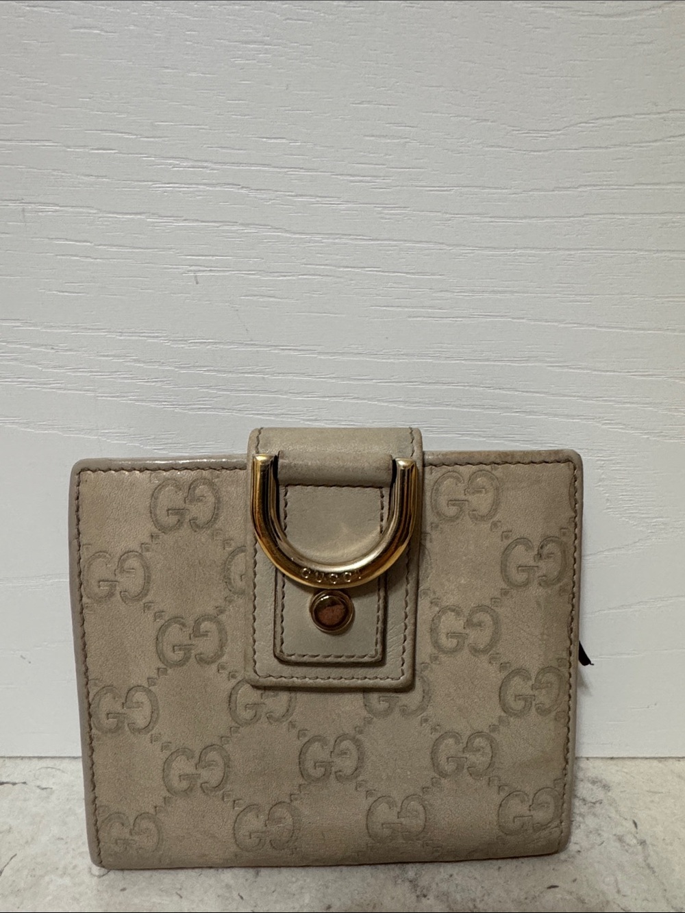 Gucci compact beige and gold wallet